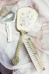 Fototapeta na wymiar Vintage hand mirror and hairbrush