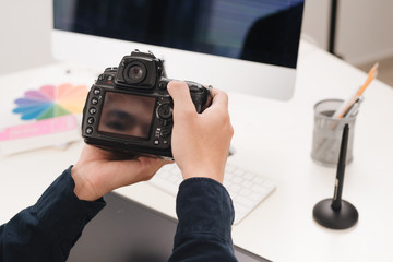 Photographer working at desk in modern office