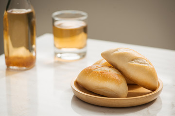 Morning breakfast with glass of tea, toast, fried eggs and bread on table