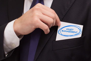 Business, technology, internet and networking concept. Young entrepreneur showing keyword: Asset...