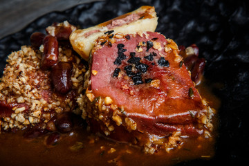 macro grilled meat steak with blood decorated with sauce