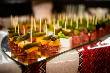Snack with cucumber, cheese, and sausage