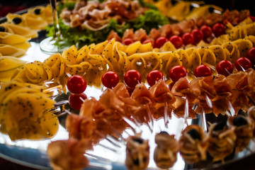 Buffet table of reception with cold snacks, meat and salads