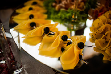 Buffet table of reception with cold snacks, meat and salads