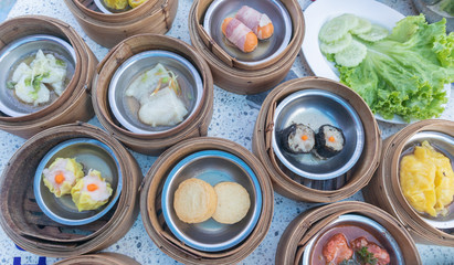 close up of variety dim sum in bamboo basket