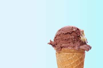 Chocolate Ice Cream Cone on Blue with Space for Copy