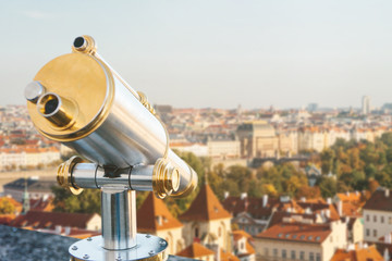 Binoculars on the viewpoint. Beautiful aerial view of the traditional old or medieval architecture...