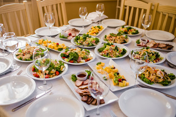 Appetizers and salads on the banquet table