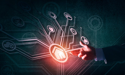 Close of businessman hand showing at user interface glowing on wall