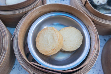 Naklejka premium close up of variety dim sum in bamboo basket