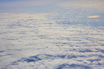 Photos of clouds from a height. Cloudy sky. Beautiful clouds in the blue sky. Clouds in clear weather. Sky texture The texture of the clouds. The texture of the earth. View of the ground from a height