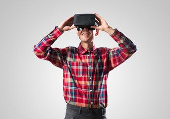 Guy in mask experiencing virtual reality as new entertainment device
