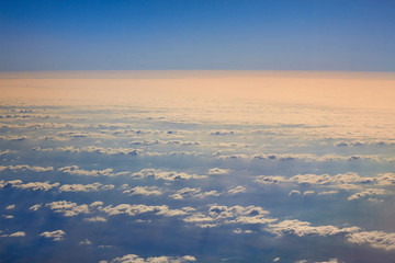 Photos of clouds from a height. Cloudy sky. Beautiful clouds in the blue sky. Clouds in clear weather. Sky texture The texture of the clouds. The texture of the earth. View of the ground from a height