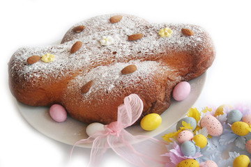Sweet Easter cake named Colomba Pasquale with Yellow Forsythia flowers isolated on white background . Italian traditional pastry 