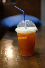Black coffee mixed soda and orange juice in glass