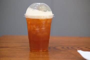 Black coffee mixed soda and orange juice in glass