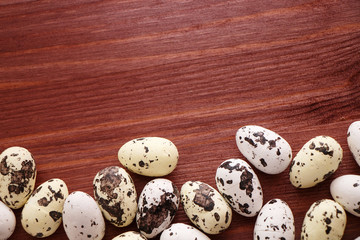Fototapeta premium Quail eggs on the wooden table