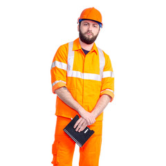 Man worker road constructor looking, notebook and pen in hand on white background isolation