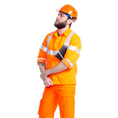 Man worker road constructor looking, notebook and pen in hand on white background isolation
