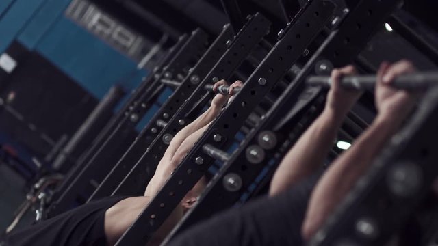 Side View - Muscular Strong Athletes Training Pull Ups.