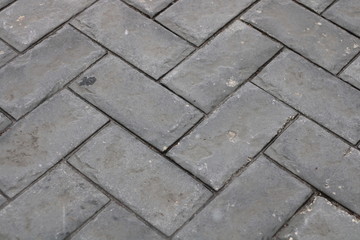 background grey cobblestones after rain