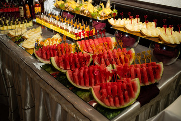 Banquet plate with watermelon on the table