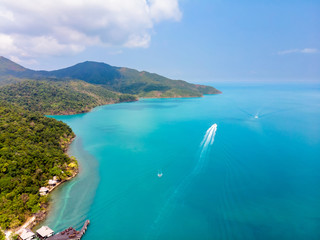 Aerial view of tropical island coast and beaches with blue transparent sea and green rainforest, paradise summer vacation holidays destination, beautiful landscape, warm sunny day