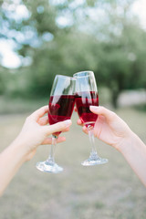 glass of red wine in hand