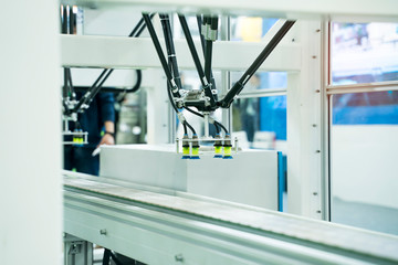 robot with vacuum suckers with conveyor in manufacture factory,Smart factory industry 4.0 concept