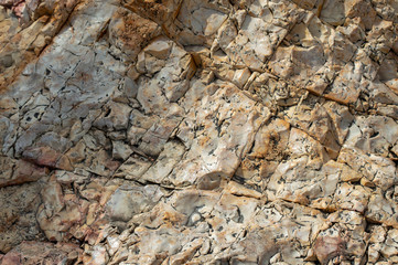 Ridges, cracks and crevices makes an interesting bakdground or texture in this rock formation.