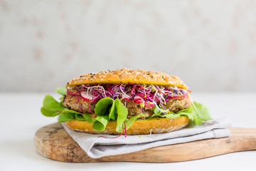 Vegan sandwich - veggie beans cutlet, curcuma bread, salad, sprouts