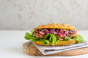 Vegan sandwich - veggie beans cutlet, curcuma bread, salad, sprouts