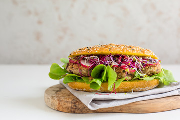 Vegan sandwich - veggie beans cutlet, curcuma bread, salad, sprouts