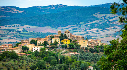 Fototapeta na wymiar Cityscape of an old town in Maremma Region in Tuscany seen from the hill, Maremma Italy