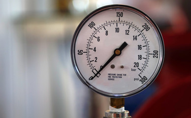 Closeup of an industrial analog meter or gauge