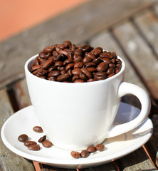 Old coffee grinder and coffee beans close-up. - Image.