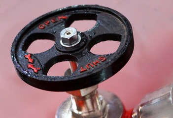 Closeup of wheel handle to control flow by open and shut positions or functions in an Industry