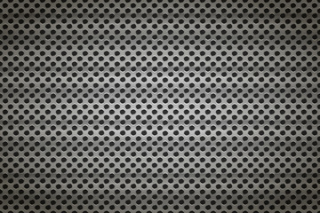 Glossy metal grid with round holes on black, detailed background