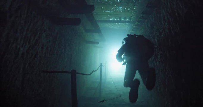 Diver exploring the Kobanya underwater mines, Budapest, Hungary
