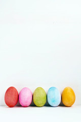 Easter eggs on white background. Side view. Happy Easter design template