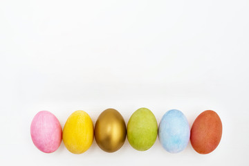Flat lay of Easter eggs on white background. Top view. High angle view.