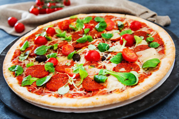 Sausage Pizza with Ham and tomatoes