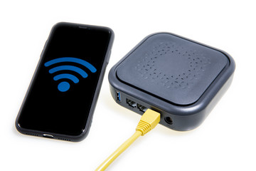 a mobile phone and a wireless router on the white background