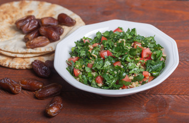 Tabbouleh salad, traditional middle eastern or arab dish. Usually prepared with parsley, mint, bulgur, tomato