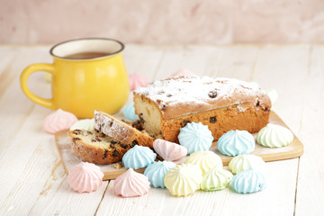 Delicious homemade cake with raisins on a light wooden background. close-up. rustic. copy space.