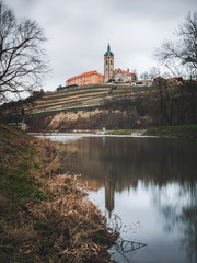  The historic Melnik castle and church tower of St. Peter and Paul at the confluence of the Vltava...