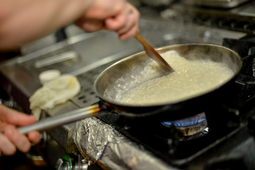 woman cooking in kitchen