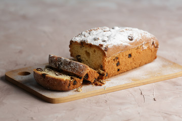 Delicious homemade cake with raisins on a light wooden background. close-up. rustic. copy space.