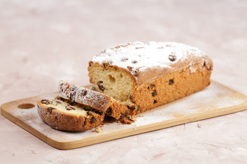 Delicious homemade cake with raisins on a light wooden background. close-up. rustic. copy space.