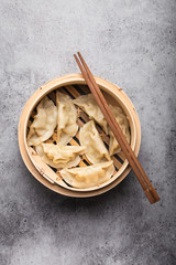 Asian dumplings in bamboo steamer